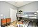 This bedroom has a bunk bed, a closet, and dresser drawers with colorful accents at 5813 Mossy Oaks Dr., North Myrtle Beach, SC 29582