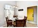 Bright dining room with a round table, wicker chairs, and a large window at 5813 Mossy Oaks Dr., North Myrtle Beach, SC 29582
