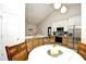 Eat in kitchen area featuring white cabinetry, stainless steel appliances, and natural light at 5813 Mossy Oaks Dr., North Myrtle Beach, SC 29582