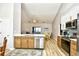 Modern kitchen features stainless steel appliances, white countertop, and light-wood cabinets at 5813 Mossy Oaks Dr., North Myrtle Beach, SC 29582