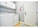 This well-lit laundry room has new appliances and extra storage space above the machines at 5813 Mossy Oaks Dr., North Myrtle Beach, SC 29582
