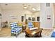 Open concept living and dining area with vaulted ceilings, ceiling fan, and wood look floors at 5813 Mossy Oaks Dr., North Myrtle Beach, SC 29582
