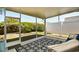 A screened in porch features plenty of space with views of the lush fenced in yard at 5813 Mossy Oaks Dr., North Myrtle Beach, SC 29582