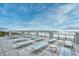 Rooftop deck offering stunning ocean views and plenty of lounge chairs for relaxation at 5813 Mossy Oaks Dr., North Myrtle Beach, SC 29582