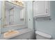 Simple bathroom featuring a neutral vanity and mirror, toilet, and basic fixtures at 6001 - 1433A S Kings Hwy., Myrtle Beach, SC 29575