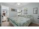 Comfortable bedroom featuring bright natural light, ceiling fan, and stylish decor at 6001 - 1433A S Kings Hwy., Myrtle Beach, SC 29575