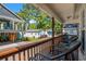 View from the deck showing a grill and seating overlooking lush greenery and neighboring homes at 6001 - 1433A S Kings Hwy., Myrtle Beach, SC 29575