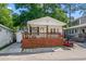Inviting single-story home with a large front porch, wooden beams, and a cozy, welcoming feel at 6001 - 1433A S Kings Hwy., Myrtle Beach, SC 29575