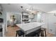 Bright kitchen featuring a marble countertop island with seating and stainless steel appliances at 6001 - 1433A S Kings Hwy., Myrtle Beach, SC 29575