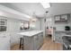 Kitchen featuring a marble countertop island with seating, unique lighting and stainless steel appliances at 6001 - 1433A S Kings Hwy., Myrtle Beach, SC 29575