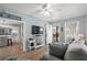 Open living room featuring a gray sofa, coastal decor, and seamless flow to the dining area and outdoor deck at 6001 - 1433A S Kings Hwy., Myrtle Beach, SC 29575