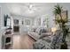 Inviting living room with a comfortable gray sofa, coastal accents, and direct access to the outdoor deck at 6001 - 1433A S Kings Hwy., Myrtle Beach, SC 29575