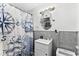Nautical-themed bathroom with vanity and ship-themed shower curtain and wallpaper at 6001- 1771 S Kings Highway, Myrtle Beach, SC 29575