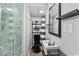 Modern bathroom featuring a sleek black toilet, unique sink, and stylish decor at 6001- 1771 S Kings Highway, Myrtle Beach, SC 29575