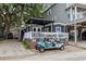 Charming beach home featuring a welcoming porch area and a convenient golf cart for easy transportation at 6001- 1771 S Kings Highway, Myrtle Beach, SC 29575
