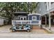 Exterior of coastal home with a golf cart and a gazebo covered outdoor space at 6001- 1771 S Kings Highway, Myrtle Beach, SC 29575