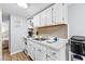 Bright kitchen with white cabinetry, countertops, and stainless steel appliances at 6001- 1771 S Kings Highway, Myrtle Beach, SC 29575