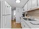 Bright kitchen features modern appliances, light countertops, and wood-look flooring at 6001- 1771 S Kings Highway, Myrtle Beach, SC 29575