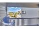 Balcony featuring seating and views of palm trees and neighboring buildings at 6001 N Ocean Blvd. # 240, North Myrtle Beach, SC 29582