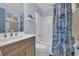 Well-lit bathroom featuring a single sink vanity, shower-tub combo, and beachy accents at 6001 N Ocean Blvd. # 240, North Myrtle Beach, SC 29582