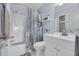 Bright bathroom featuring a shower-tub combo, white vanity, and coastal-themed decor at 6001 N Ocean Blvd. # 240, North Myrtle Beach, SC 29582
