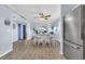 Spacious dining area flowing into the living area with beachy decorations and new flooring at 6001 N Ocean Blvd. # 240, North Myrtle Beach, SC 29582