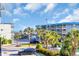 Beautiful exterior view of buildings, palm trees, and blue sky, showcasing the serene coastal location at 6001 N Ocean Blvd. # 240, North Myrtle Beach, SC 29582