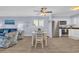 Open concept living and dining area with stainless steel appliances and coastal decor at 6001 N Ocean Blvd. # 240, North Myrtle Beach, SC 29582