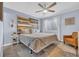 Bright Primary bedroom with a king bed, stylish decor, and wood accent wall at 6001 N Ocean Blvd. # 240, North Myrtle Beach, SC 29582