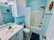 Nautical themed bathroom with a single sink vanity, shower and tub combination and blue walls at 6001 - Z47 S Kings Hwy., Myrtle Beach, SC 29575