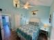 Bedroom featuring a queen bed, blue walls, and Luxury Vinyl Plank (LVP) flooring at 6001 - Z47 S Kings Hwy., Myrtle Beach, SC 29575