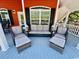 Charming covered porch with cozy seating, perfect for enjoying the outdoors at 6001 - Z47 S Kings Hwy., Myrtle Beach, SC 29575