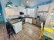 Bright kitchen features stainless steel appliances, white cabinetry, a breakfast bar and a dining area at 6001 - Z47 S Kings Hwy., Myrtle Beach, SC 29575