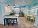 Bright kitchen features stainless steel appliances, white cabinetry, a breakfast bar and a dining area at 6001 - Z47 S Kings Hwy., Myrtle Beach, SC 29575