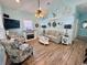 Coastal-themed living room featuring a fireplace and nautical decor at 6001 - Z47 S Kings Hwy., Myrtle Beach, SC 29575