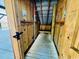 Rustic outdoor shower with wooden walls and a convenient bench at 6001 - Z47 S Kings Hwy., Myrtle Beach, SC 29575