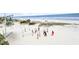 Aerial view of a lively beach volleyball game near the ocean on a sunny day at 6001-N53 S Kings Hwy., Myrtle Beach, SC 29575
