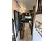 Hallway with painting leading to a living room and dining area at 6001-N53 S Kings Hwy., Myrtle Beach, SC 29575