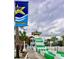 Exciting waterpark attraction with a towering green and white striped waterslide near palm trees at 6001-N53 S Kings Hwy., Myrtle Beach, SC 29575