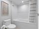 Bright bathroom showcasing a tub with tile surround and modern fixtures at 603 S Ocean Blvd. # 912, North Myrtle Beach, SC 29582
