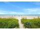 Picturesque path leading to the beach, surrounded by lush vegetation and tranquil scenery at 603 S Ocean Blvd. # 912, North Myrtle Beach, SC 29582