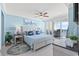 Serene bedroom with blue accents, complemented by a ceiling fan and balcony access at 603 S Ocean Blvd. # 912, North Myrtle Beach, SC 29582
