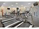Well-equipped gym with treadmills, stationary bikes, weight machines, and multiple televisions at 603 S Ocean Blvd. # 912, North Myrtle Beach, SC 29582
