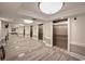 Bright, tiled hallway with multiple elevators and recessed lighting creating a clean, modern aesthetic at 603 S Ocean Blvd. # 912, North Myrtle Beach, SC 29582