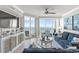 Bright living room featuring plush seating, ocean views, and access to outdoor balcony at 603 S Ocean Blvd. # 912, North Myrtle Beach, SC 29582