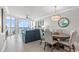Bright living room area with sliding glass doors out to the deck with views of the ocean at 603 S Ocean Blvd. # 912, North Myrtle Beach, SC 29582