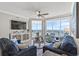 Comfortable and modern living area with ocean views from floor to ceiling sliding glass doors at 603 S Ocean Blvd. # 912, North Myrtle Beach, SC 29582