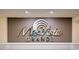 Elegant Max Vista Grande lobby sign with stylish font, metallic accents, and recessed lighting at 603 S Ocean Blvd. # 912, North Myrtle Beach, SC 29582