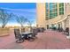 Inviting outdoor patio featuring elegant seating, tables, and a building with floor to ceiling windows at 603 S Ocean Blvd. # 912, North Myrtle Beach, SC 29582