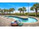Lazy river pool with palm trees, featuring colorful inflatable floats and brick-paved sundeck at 603 S Ocean Blvd. # 912, North Myrtle Beach, SC 29582